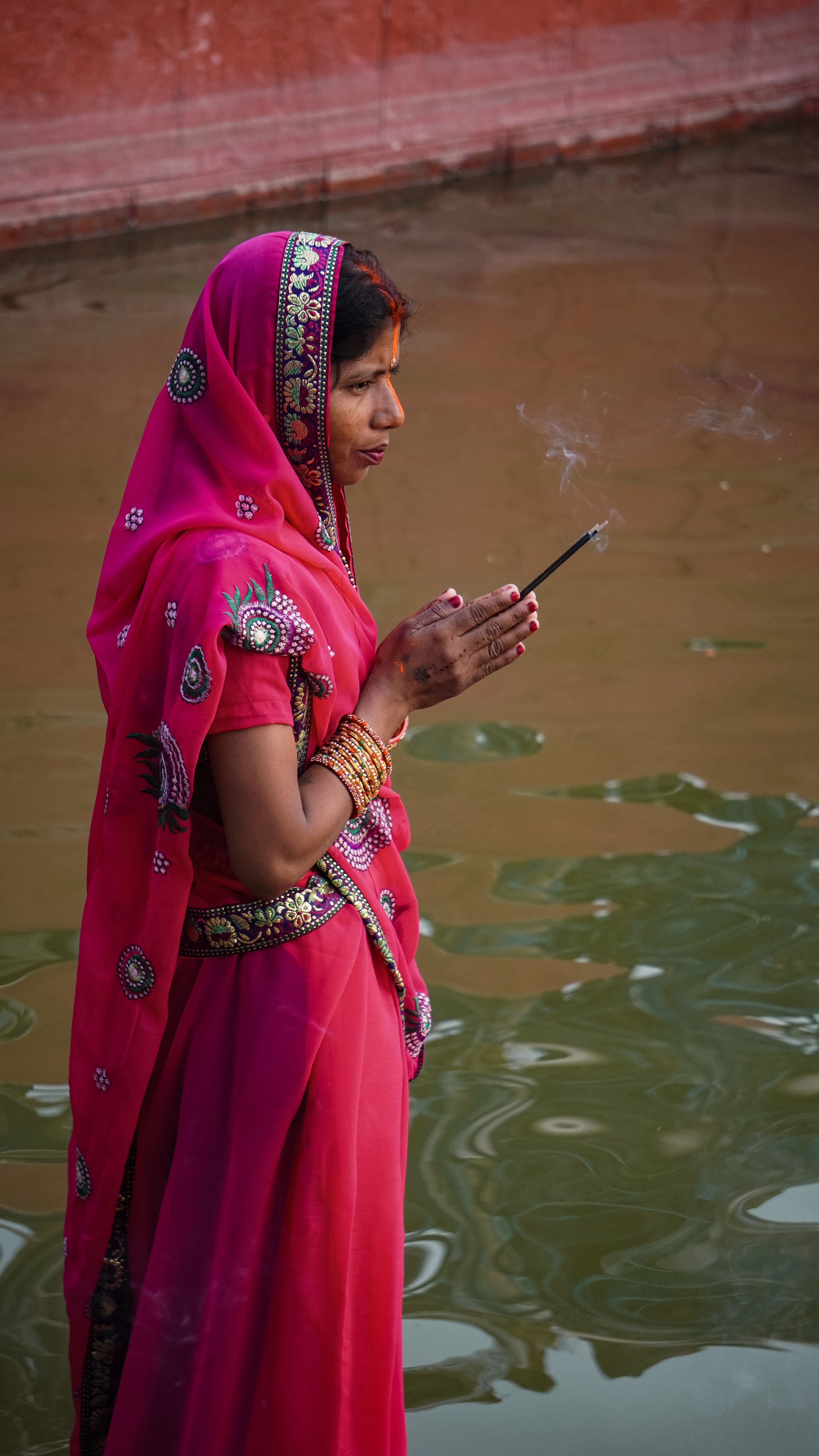 Traditional Indian Woman in Pink Sari Performing Ritual · Free Stock Photo
