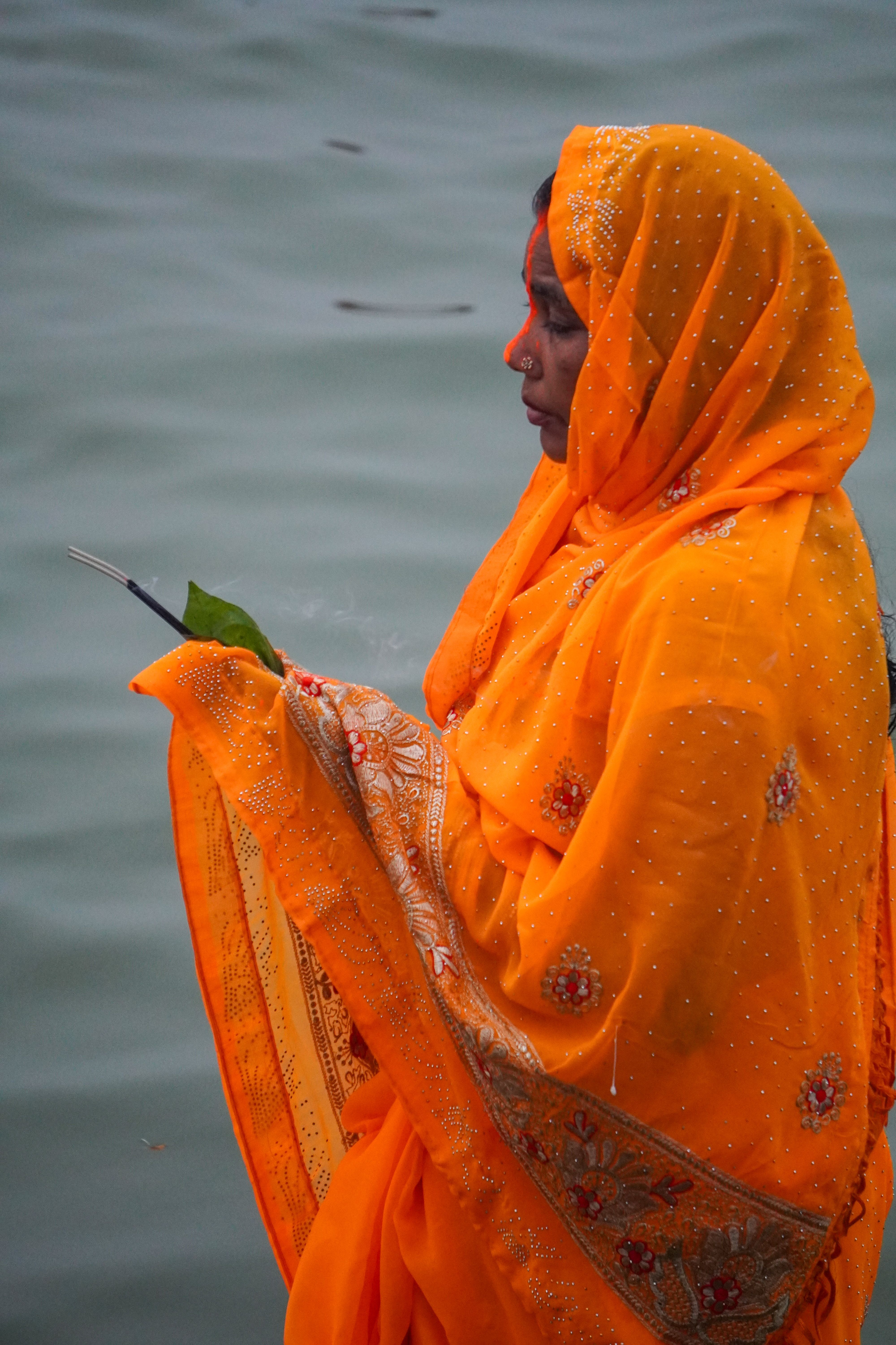 Traditional Ritual by the Water's Edge · Free Stock Photo