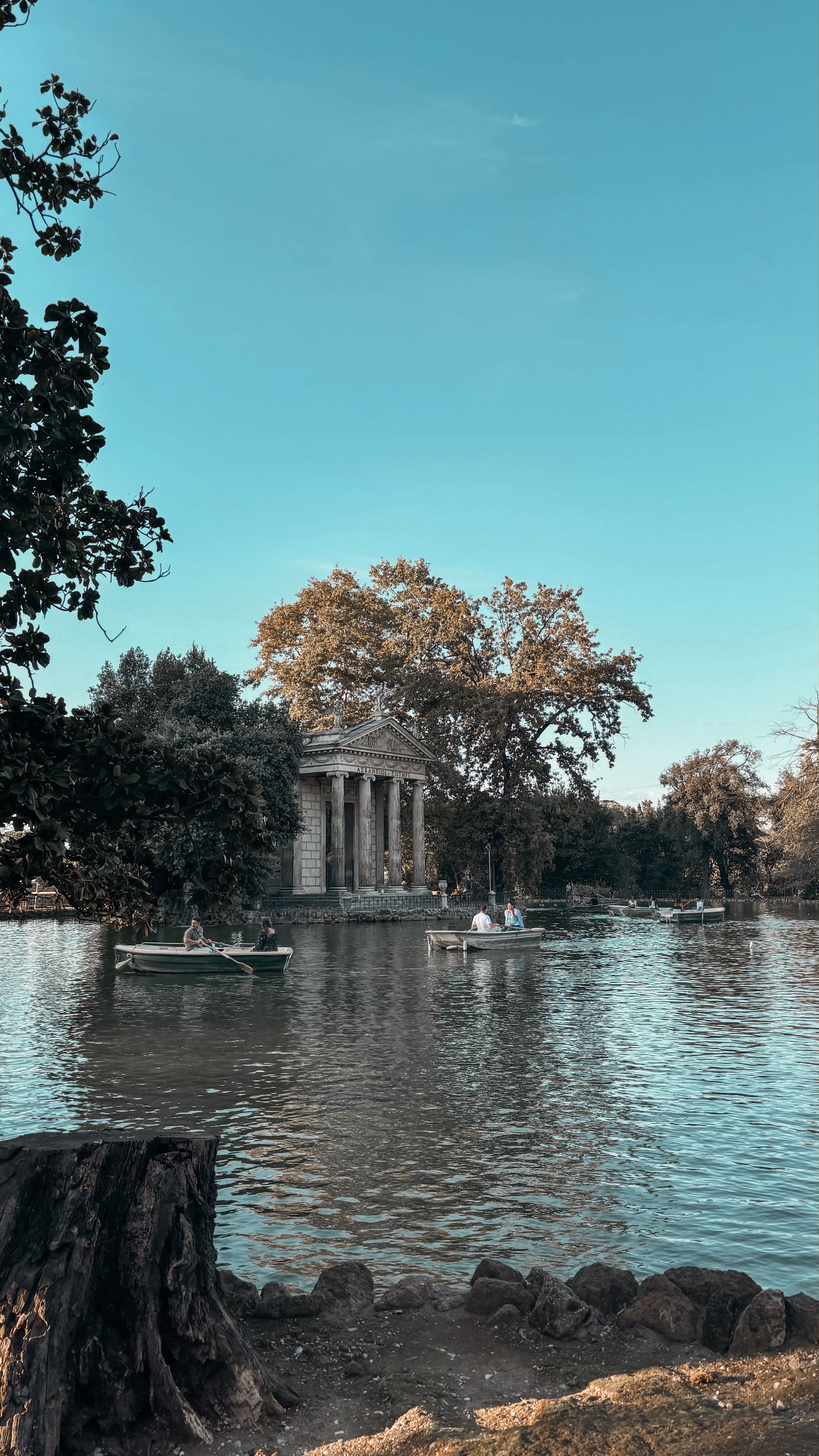 Villa Borghese Gardens in Rome, peaceful park with lake and trees in wide landscape view