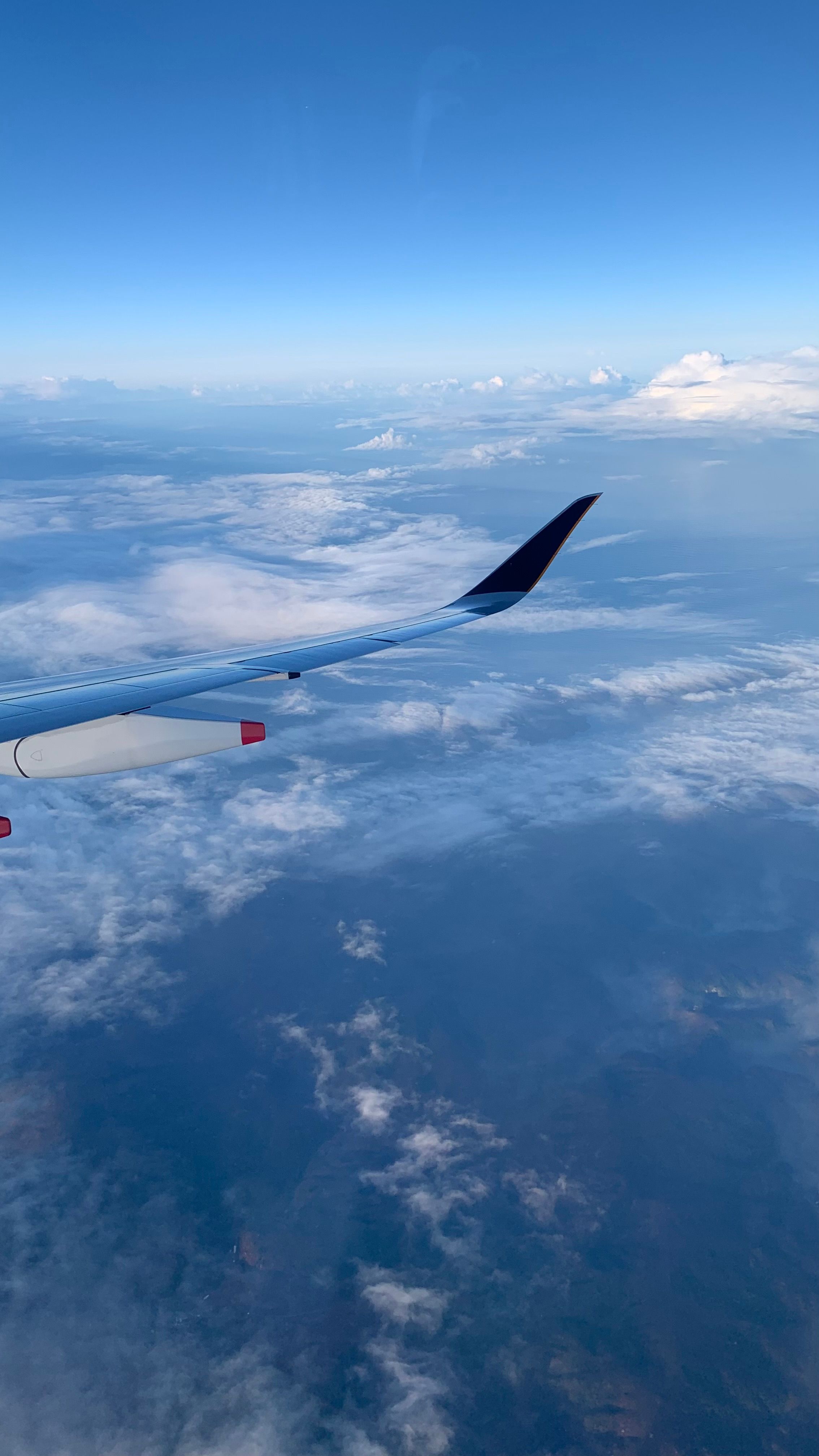 Aerial View of Clouds from Airplane Window · Free Stock Photo