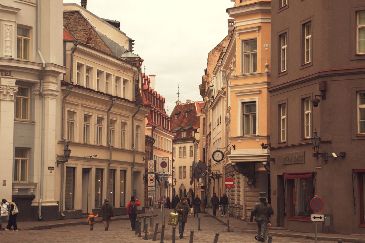 a bustling street scene in tallinn s old town featuring historic archi