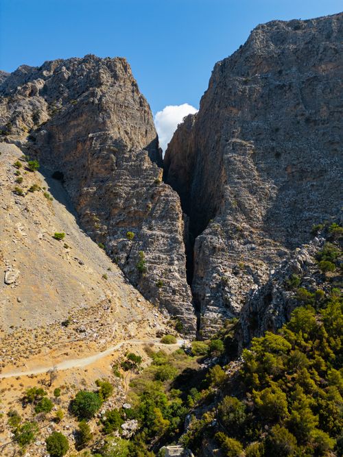 Free Stunning view of a rocky mountain gorge under a bright blue sky on a sunny day. Stock Photo