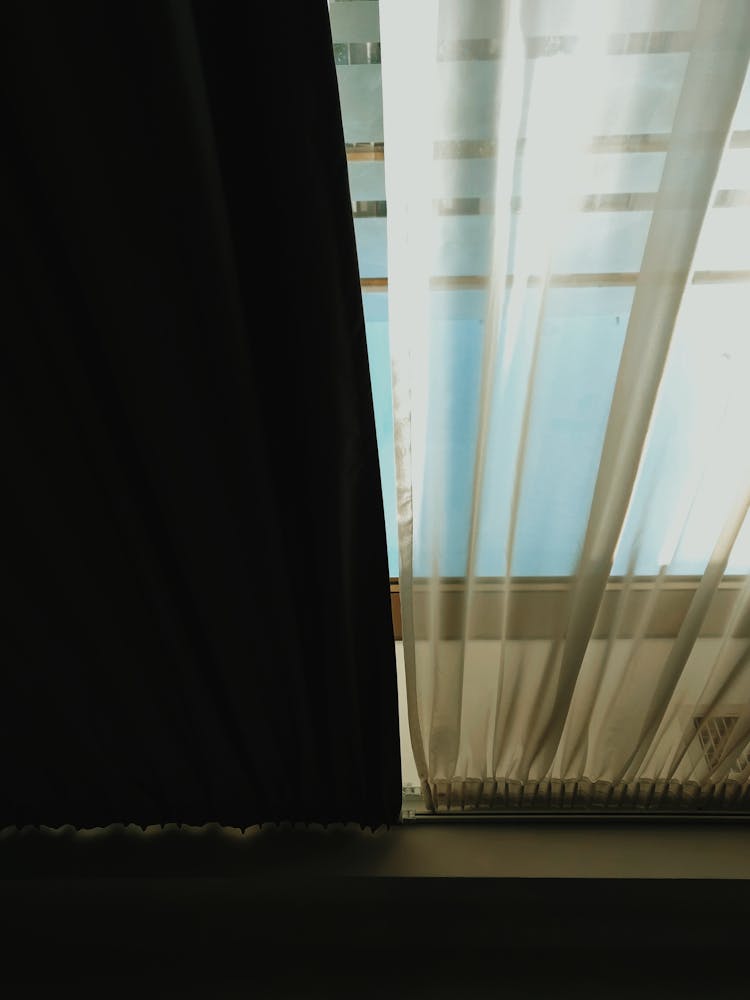 Low Angle Shot Of Black And Sheer Curtains