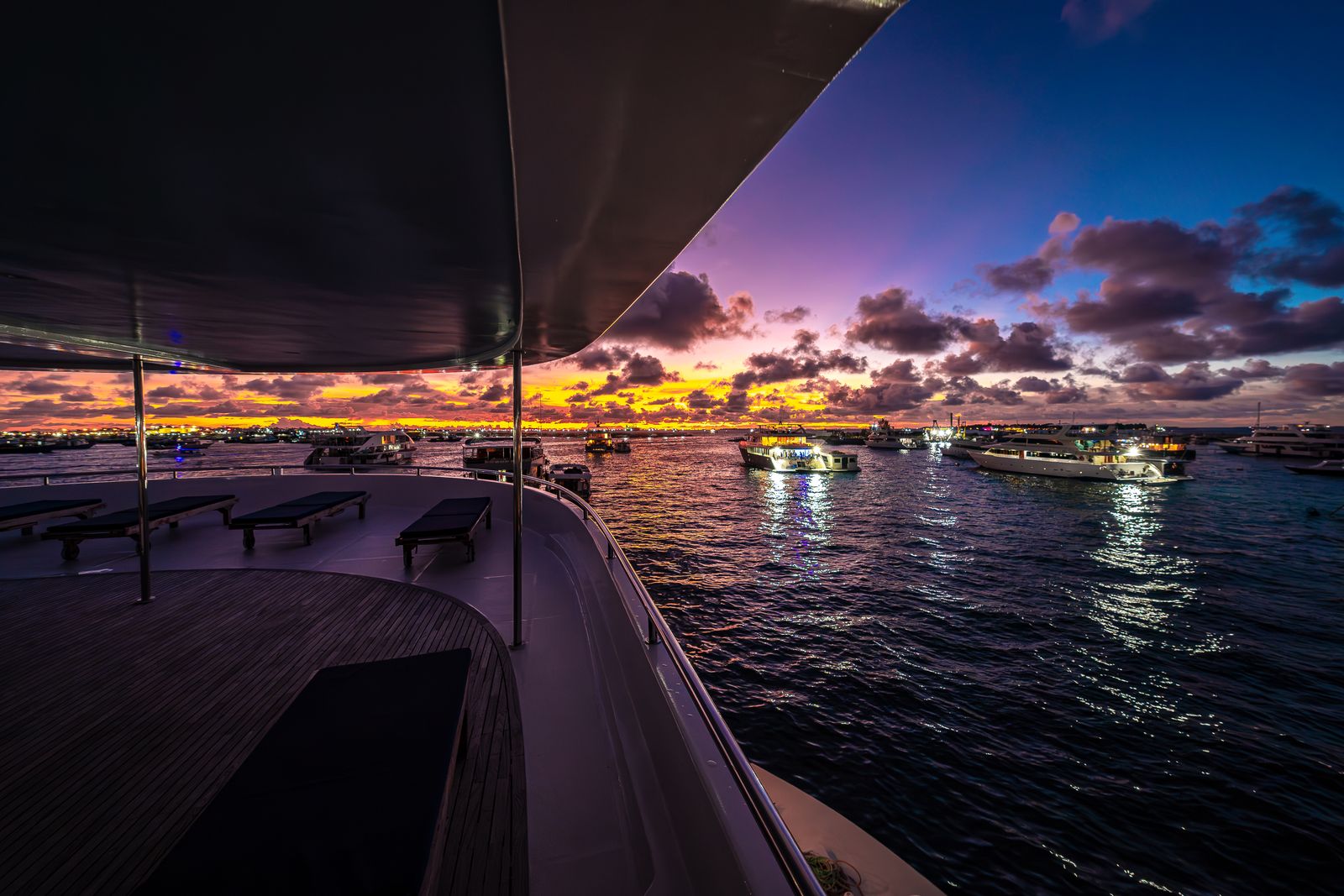 Tranquil sunset cruise with colorful sky