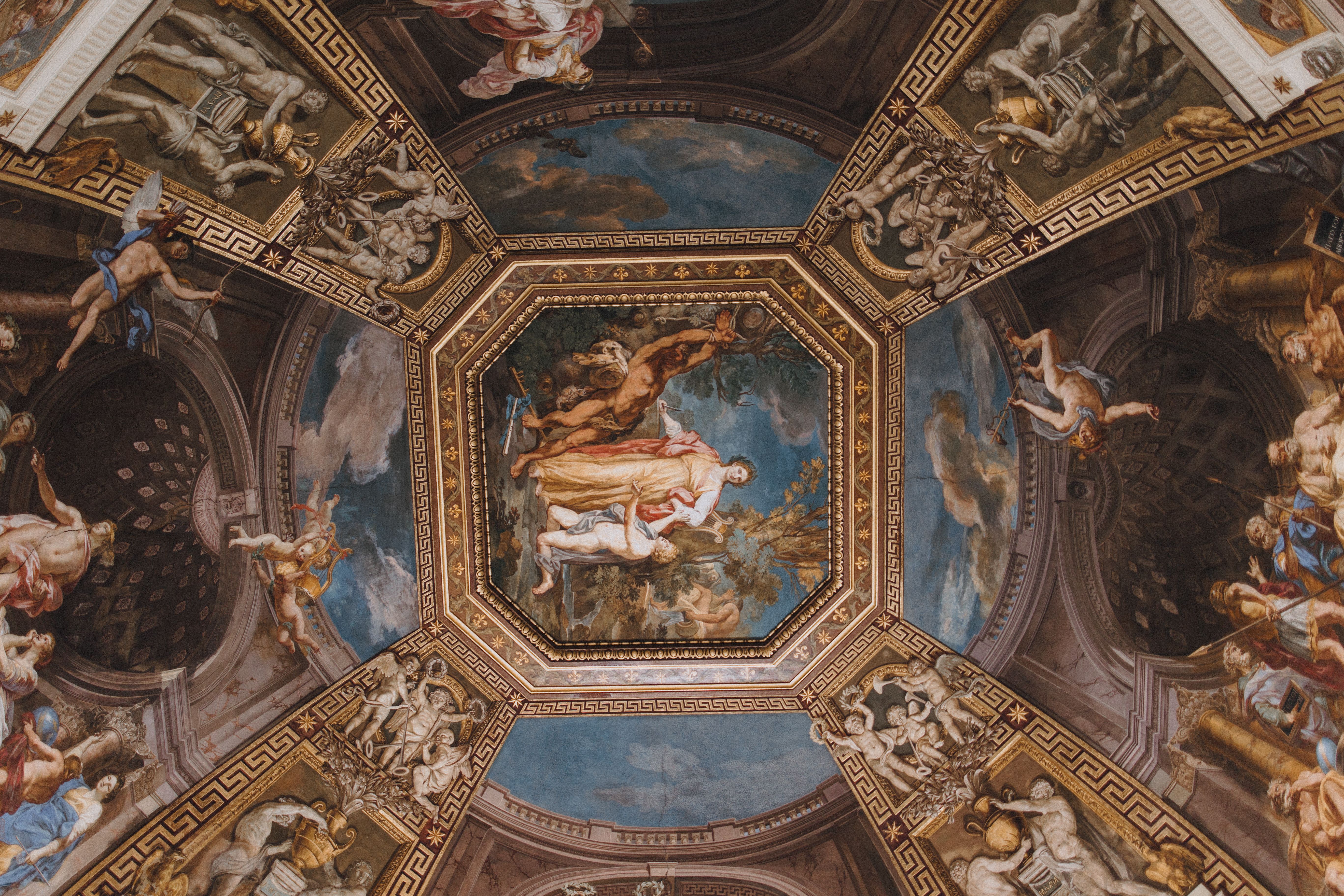 Detailed view of ornate Renaissance fresco on a Vatican City ceiling.