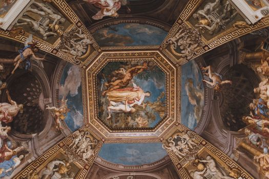 Detailed view of ornate Renaissance fresco on a Vatican City ceiling.