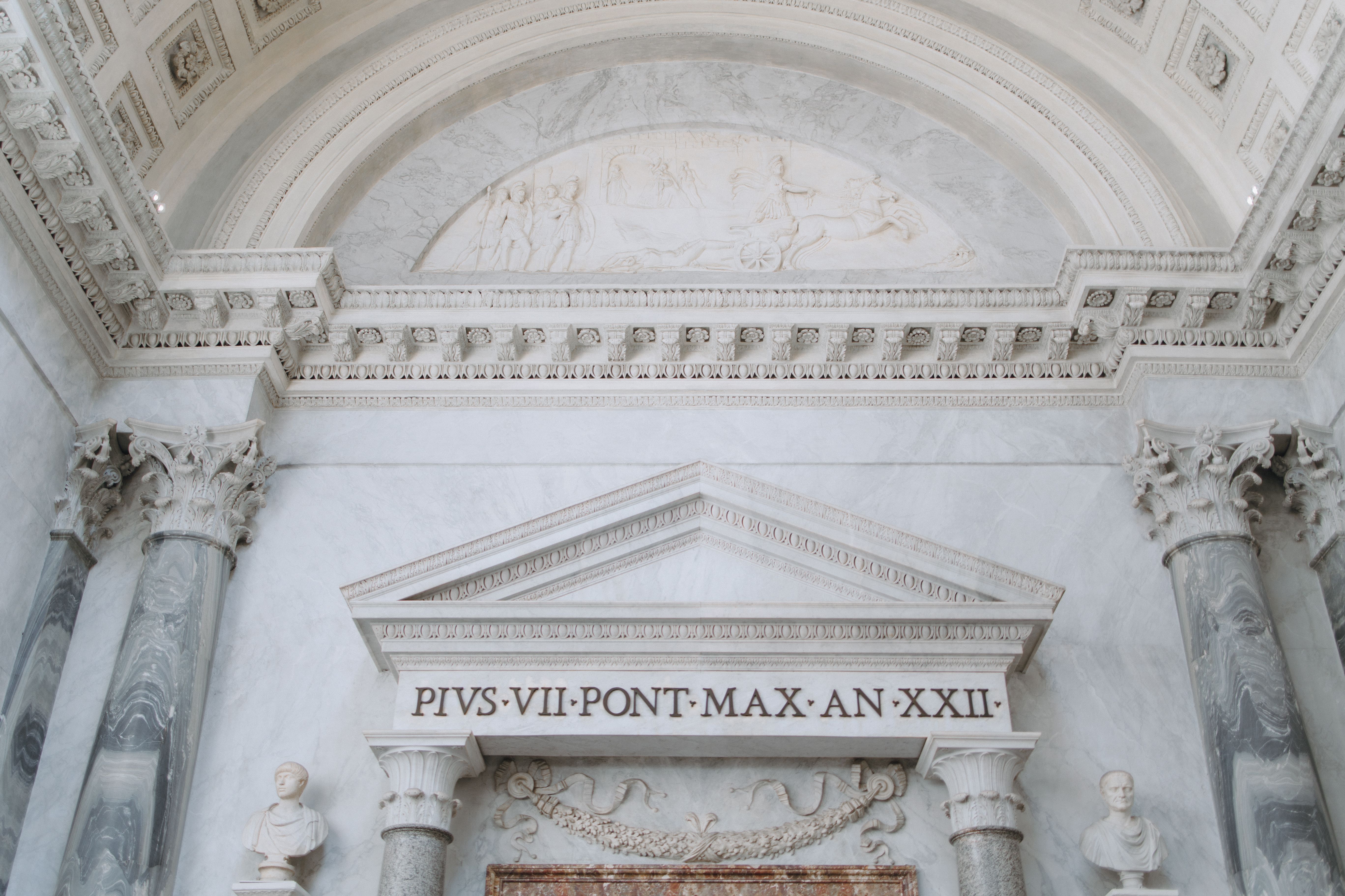 Elegant marble architectural details from Vatican City, highlighting classical Roman elements and design.
