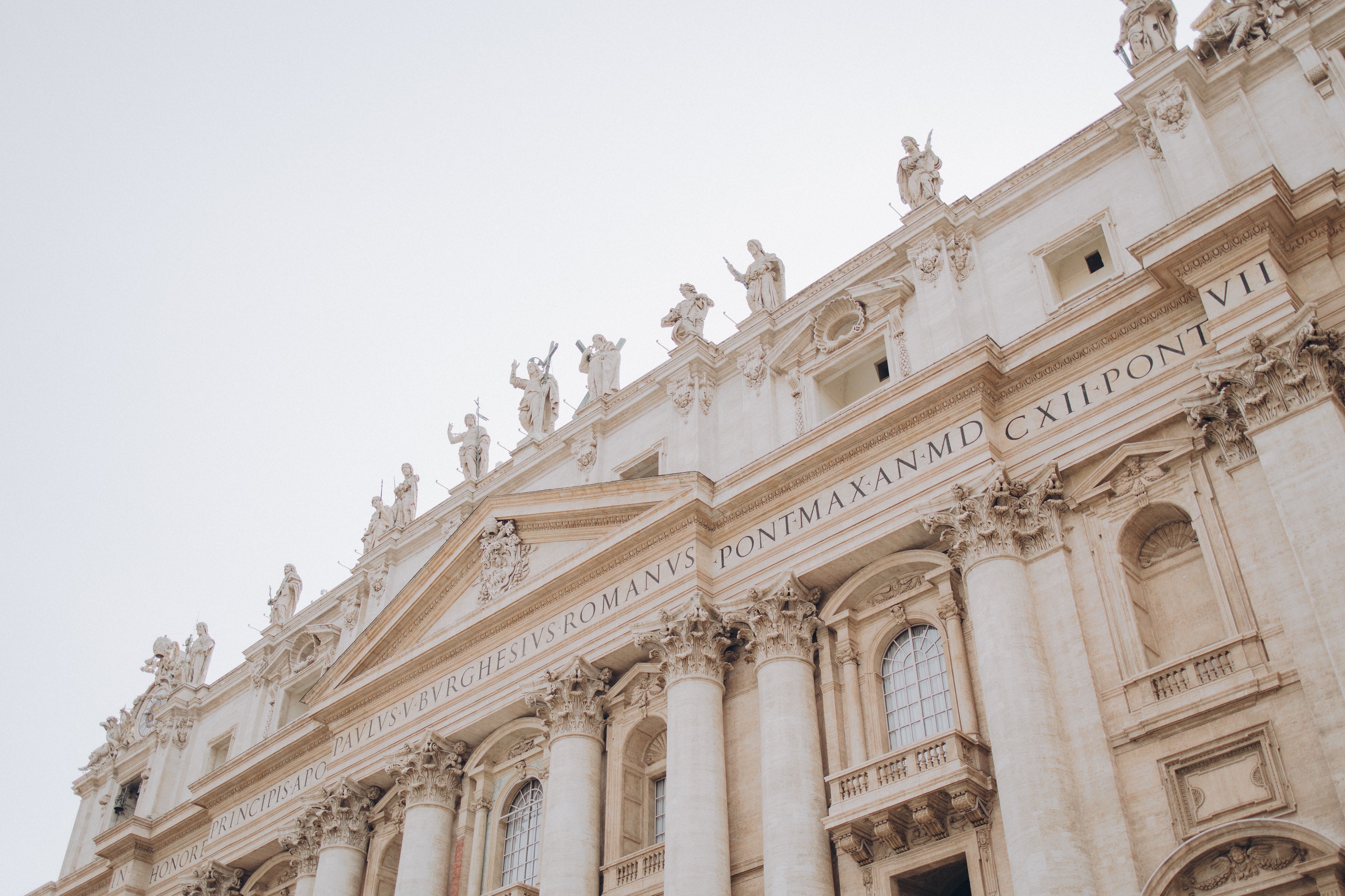 Detailed view of St. Peter's Basilica facade in Vatican City, showcasing architectural grandeur.