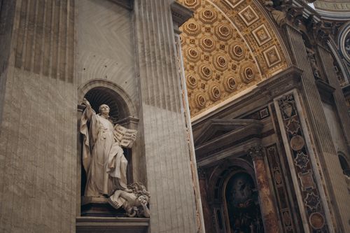 Free Intricate statue and ornate architecture inside St. Peter's Basilica, Vatican City. Stock Photo