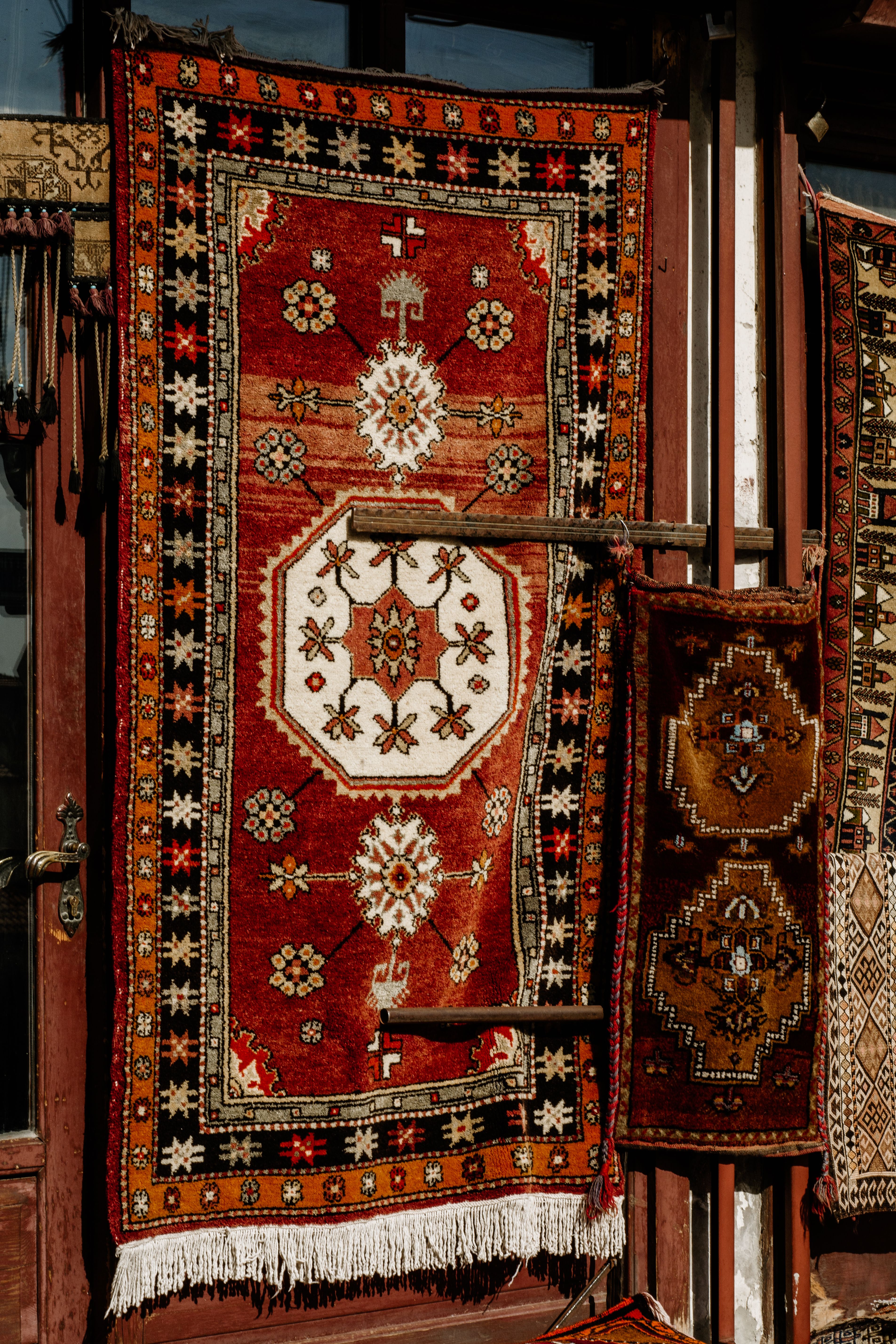 Traditional Oriental Rugs on Display Outdoors · Free Stock Photo