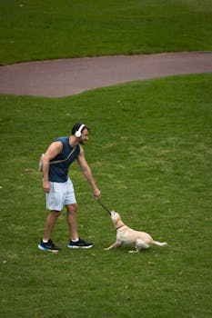 Man enjoys a day outdoors walking his dog in a Buenos Aires park. Active lifestyle in autumn.