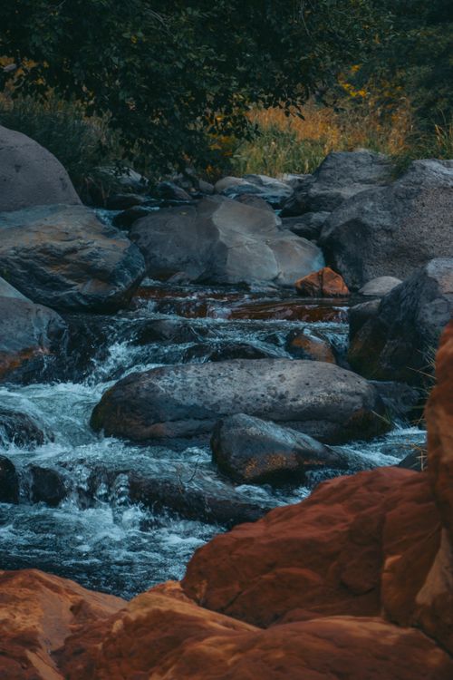 Free Peaceful flowing stream through rocks in Sedona, Arizona, perfect for nature lovers. Stock Photo