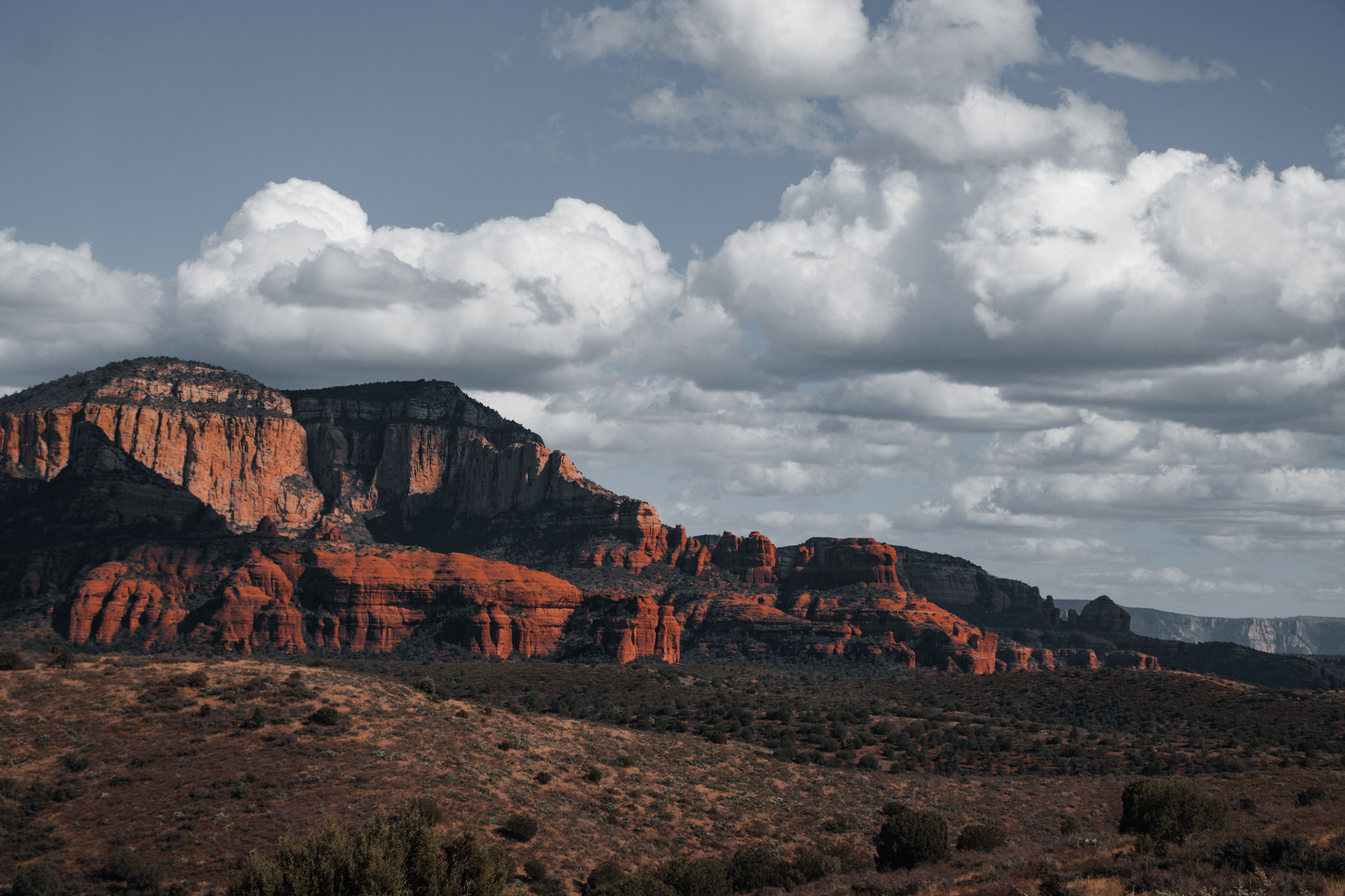 Stunning Ancient Sedona (30+ Mile) - Sedona Helicopter Tour Review Review 2026 - A breathtaking view of Sedona's iconic red rock formations under a dramatic sky.