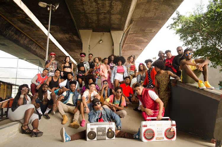 Group Of People Gathering Under Bridge