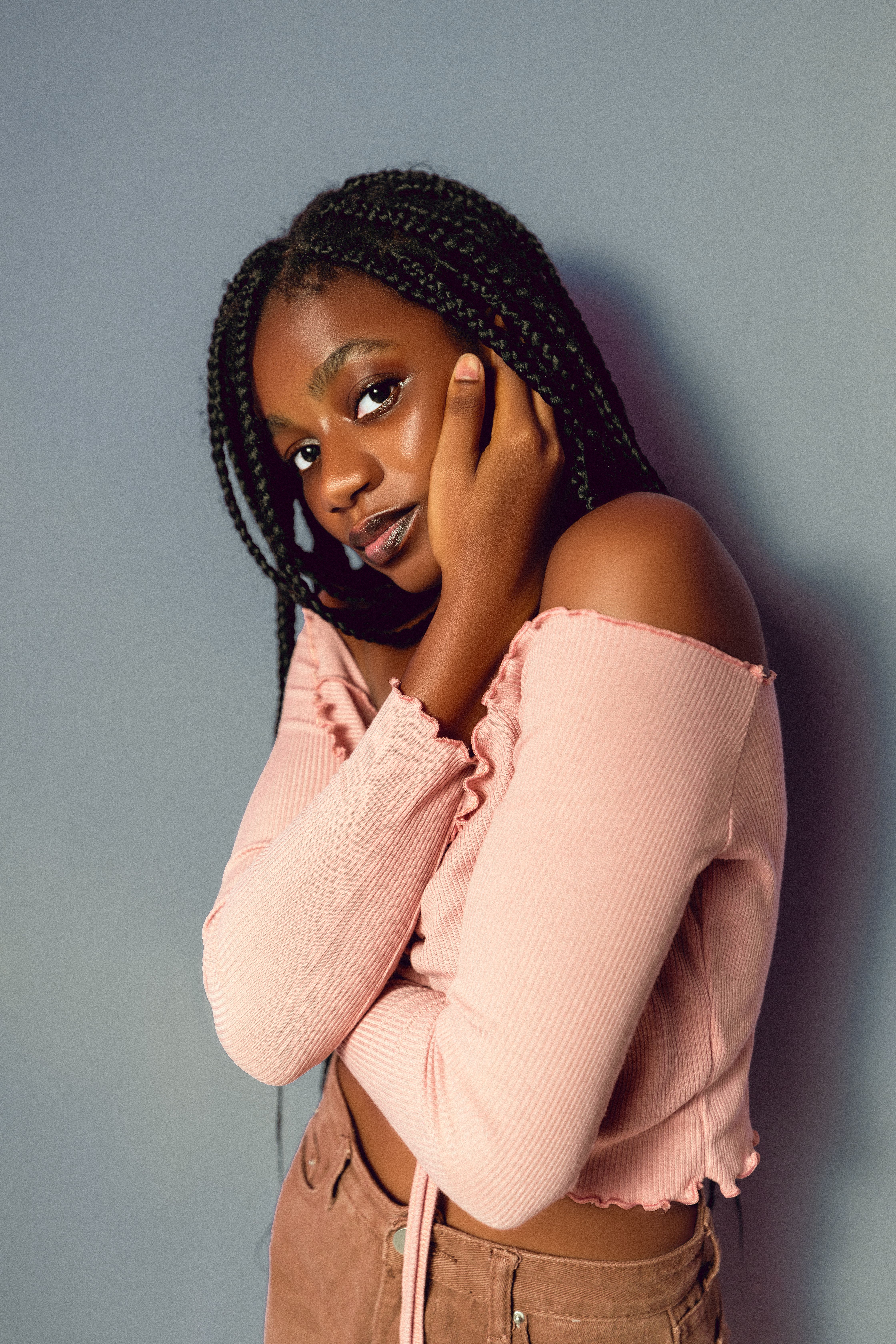 Elegant Portrait of a Young Woman in Pink · Free Stock Photo