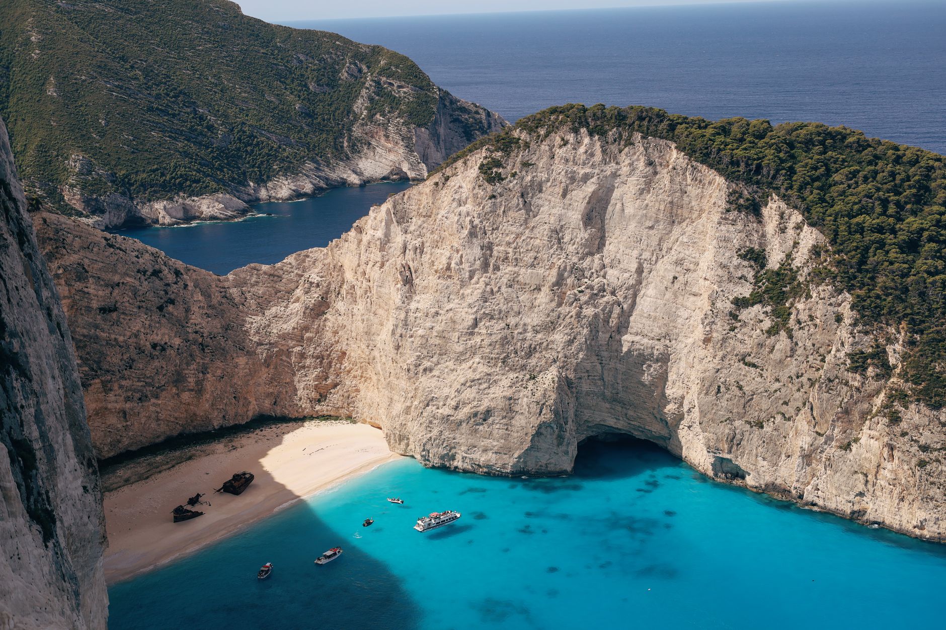 Stunning aerial view of Navagio Beach with turquoise waters, Zakynthos Island, Greece.