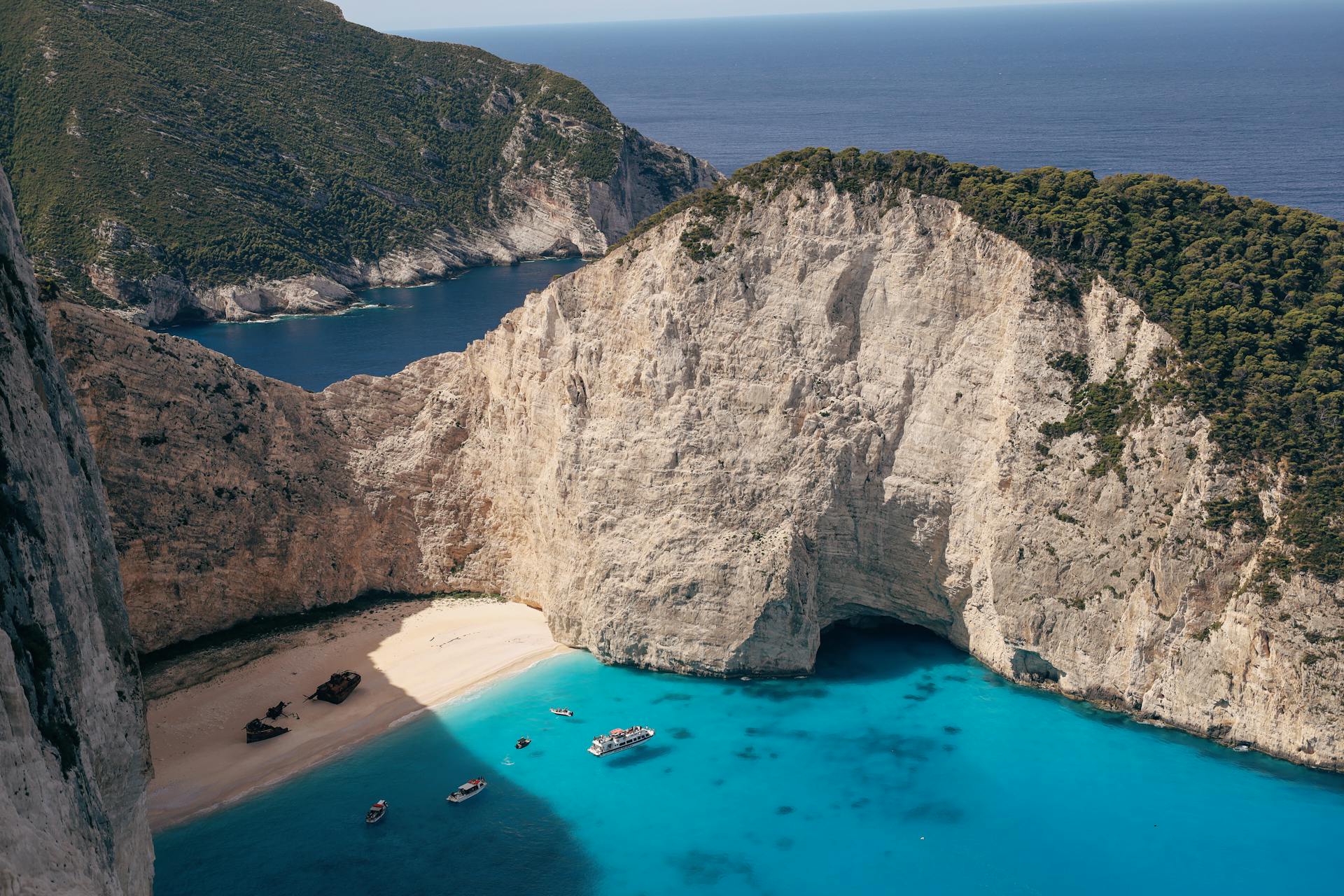 Stunning aerial view of Navagio Beach with turquoise waters, Zakynthos Island, Greece.