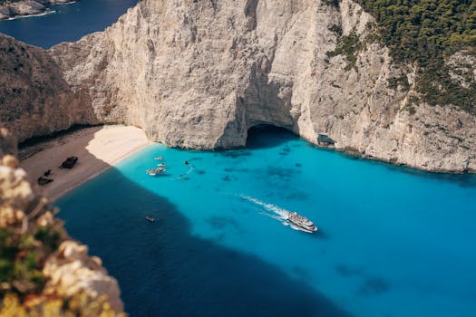Stunning aerial view of Navagio Beach in Zakynthos, Greece with blue waters.