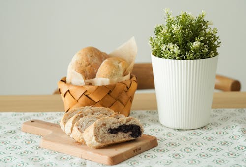 Photo Of Baked Breads Beside An Indoor Plant