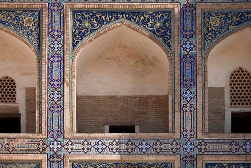 Free Close-up of traditional Middle Eastern facade featuring detailed tile work and arches. Stock Photo
