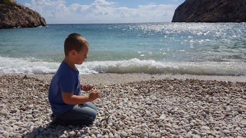 Free stock photo of child, pebbles, seabeach