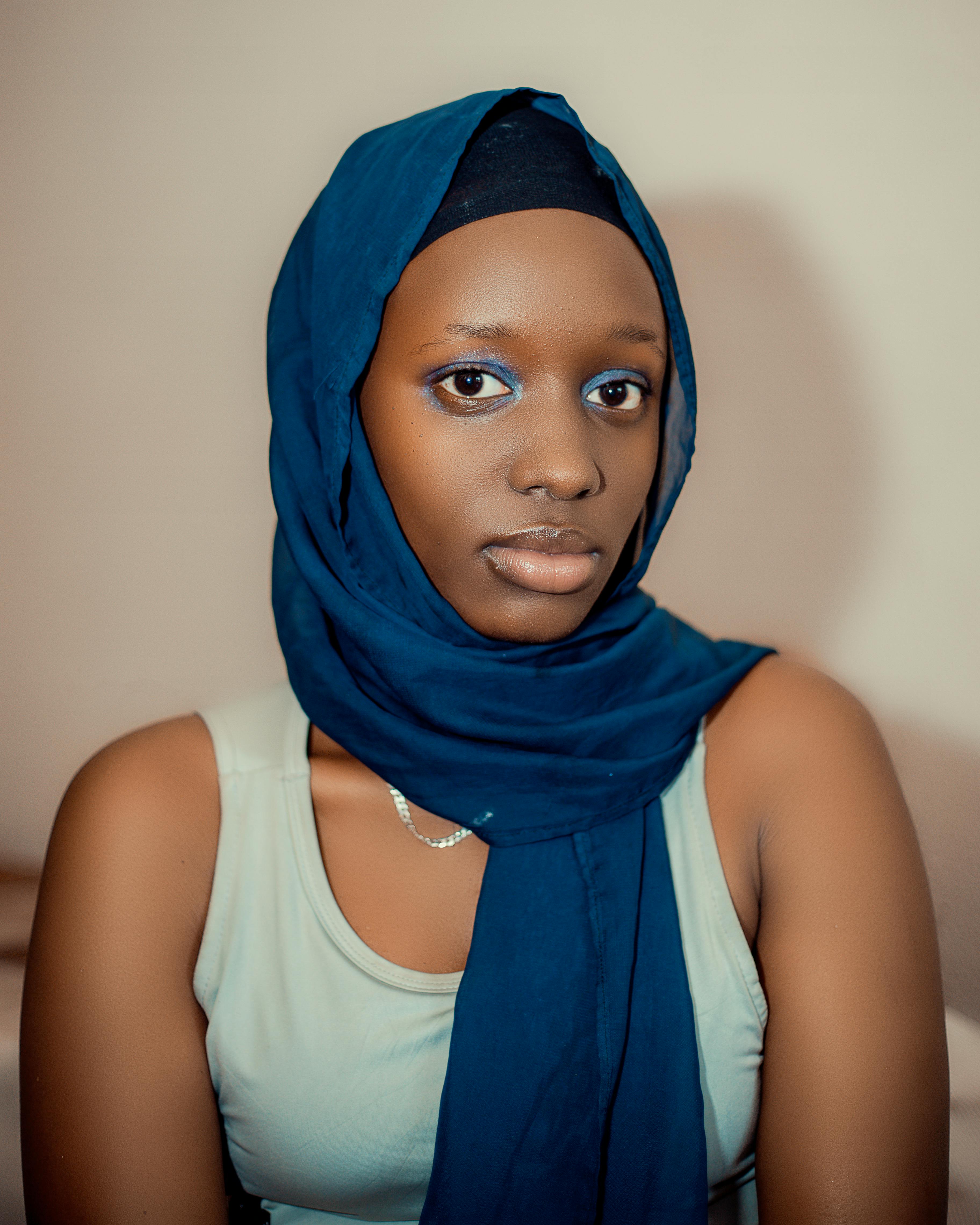 elegant portrait of a woman in blue hijab