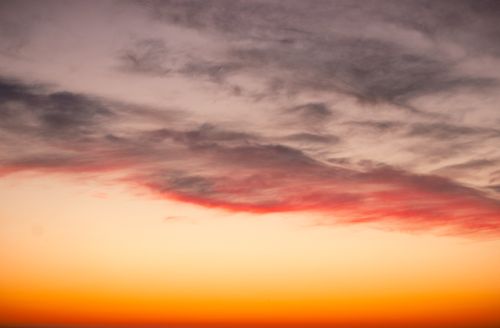 Free Beautiful orange and golden sunset sky with clouds in Hamburg, Germany. Stock Photo