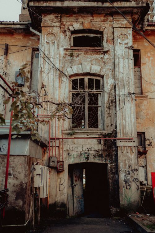Free Intriguing facade of an old, abandoned building in Georgia, showcasing urban decay. Stock Photo