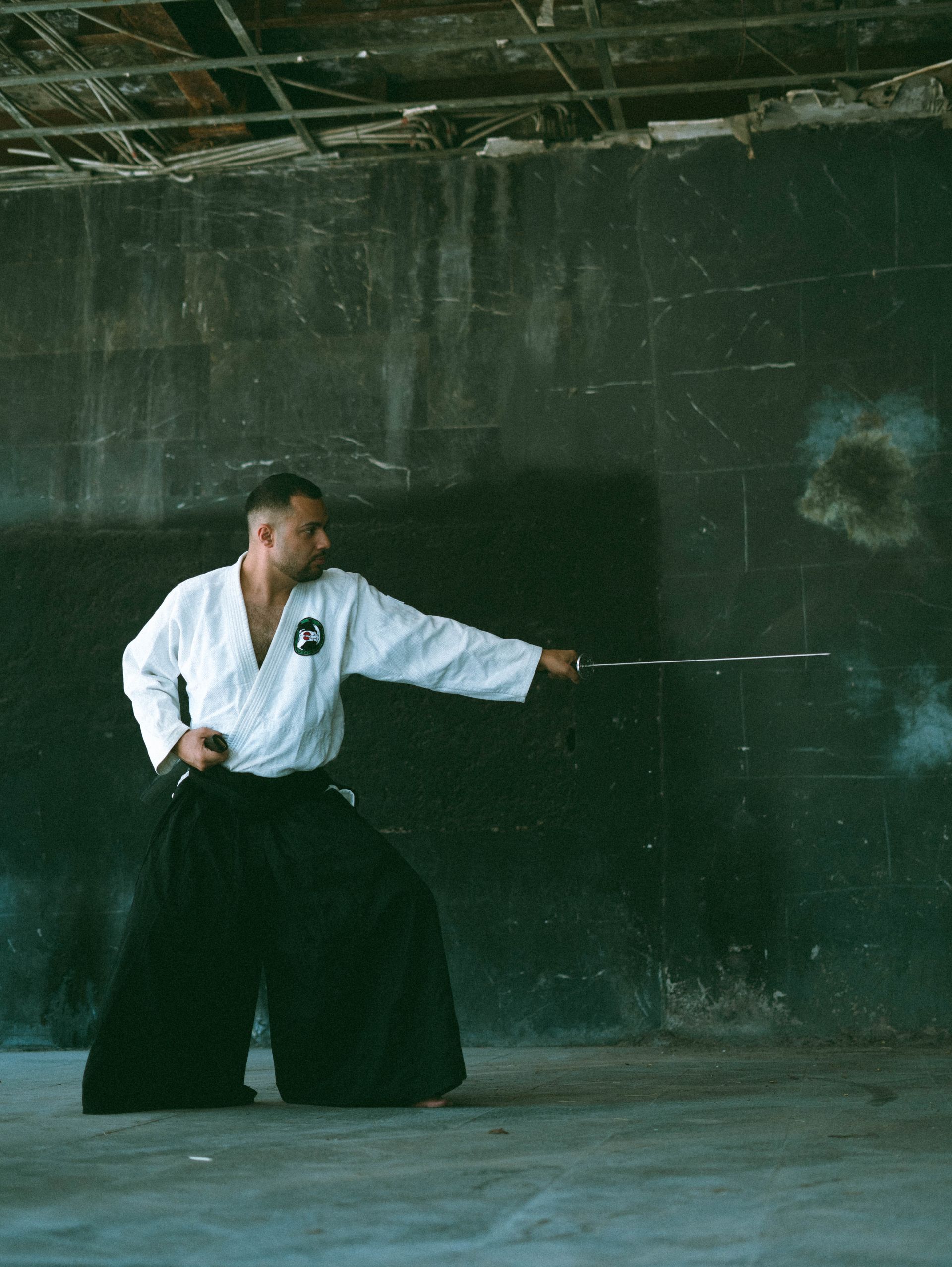 Iaido practitioner in traditional attire drawing a katana