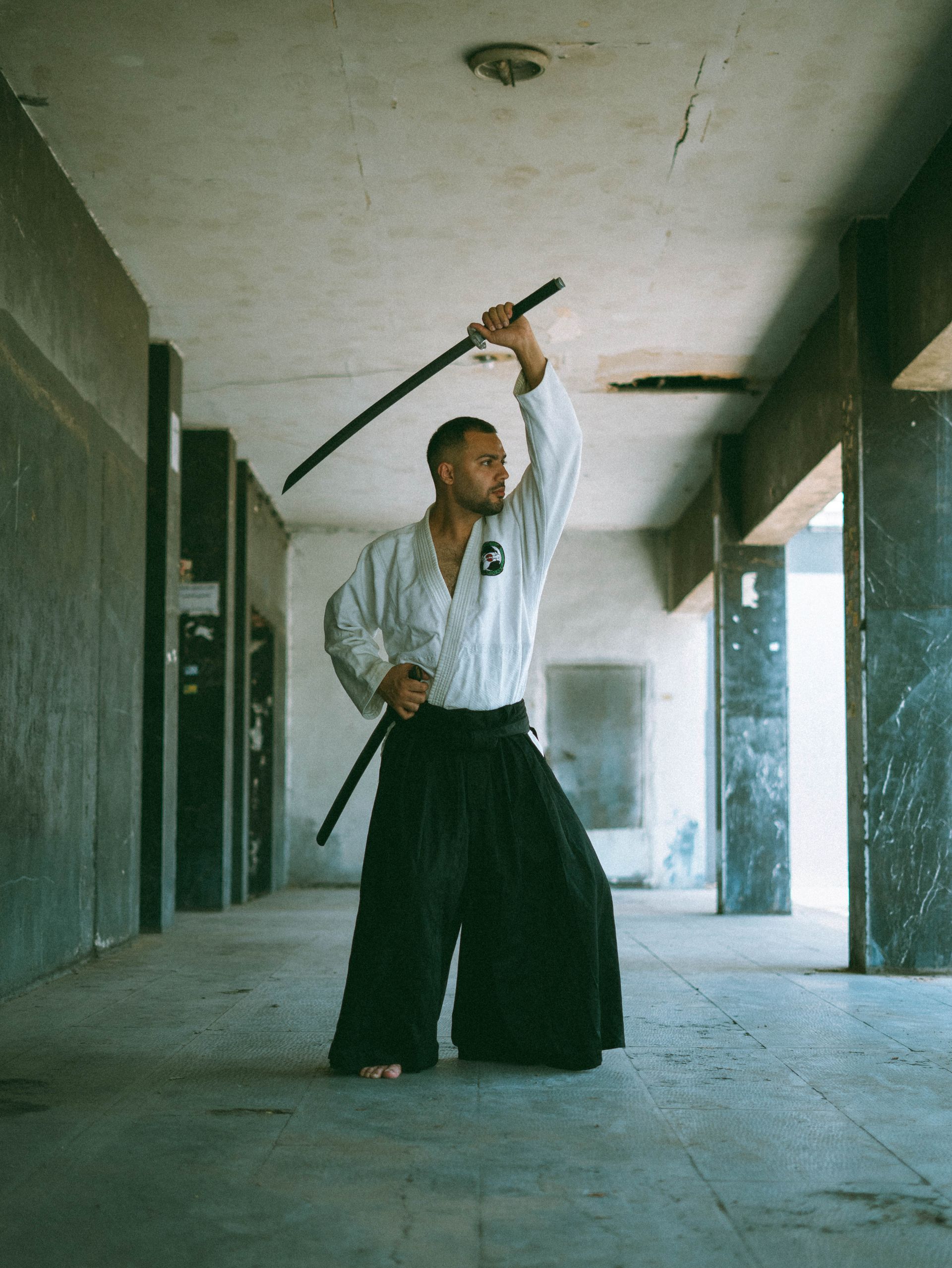 Iaido practitioner practicing katana technique with focus and discipline