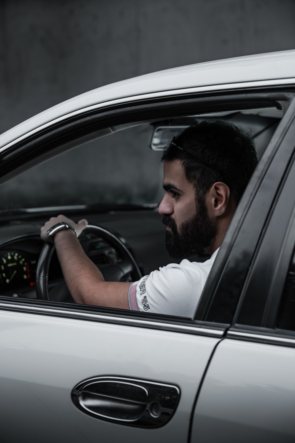 A driver focused on the road, hands on the wheel