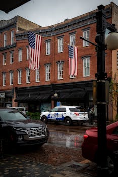 Rainy day in Savannah, Georgia, showing American flags on historic buildings.