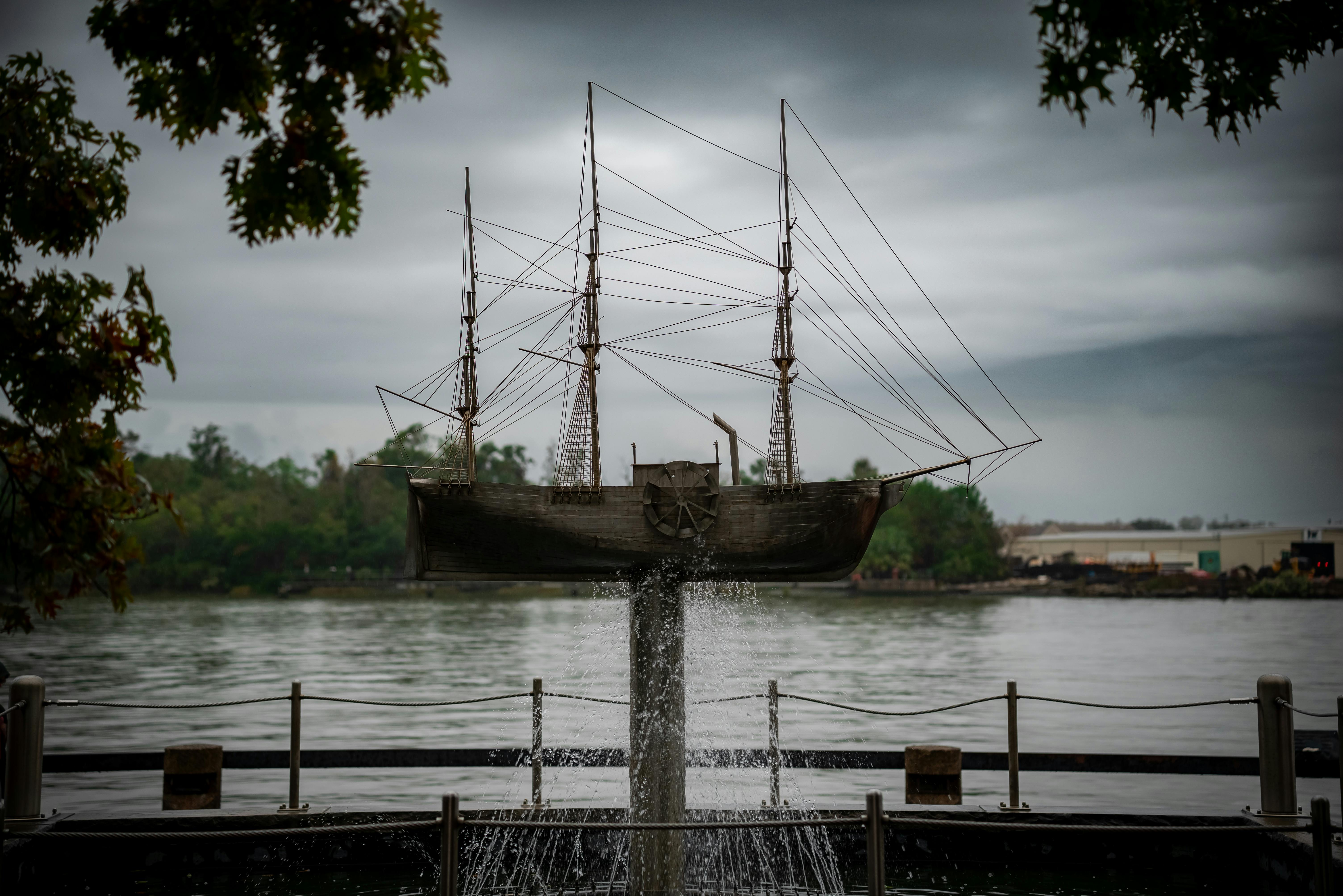 A striking ship sculpture set against the scenic Savannah River in Georgia, under a moody sky. in Visit