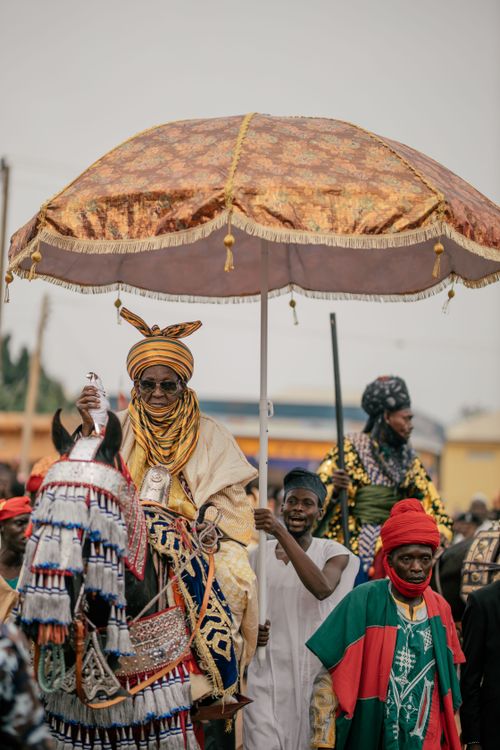 Free A colorful traditional parade featuring Nigerian attire and customs. Stock Photo