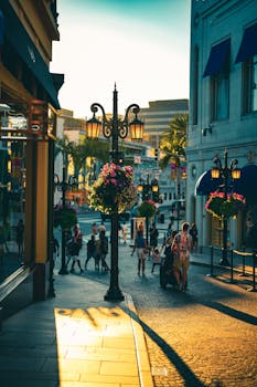Charming Beverly Hills street scene with elegant lampposts, flowers, and evening sunlight.
