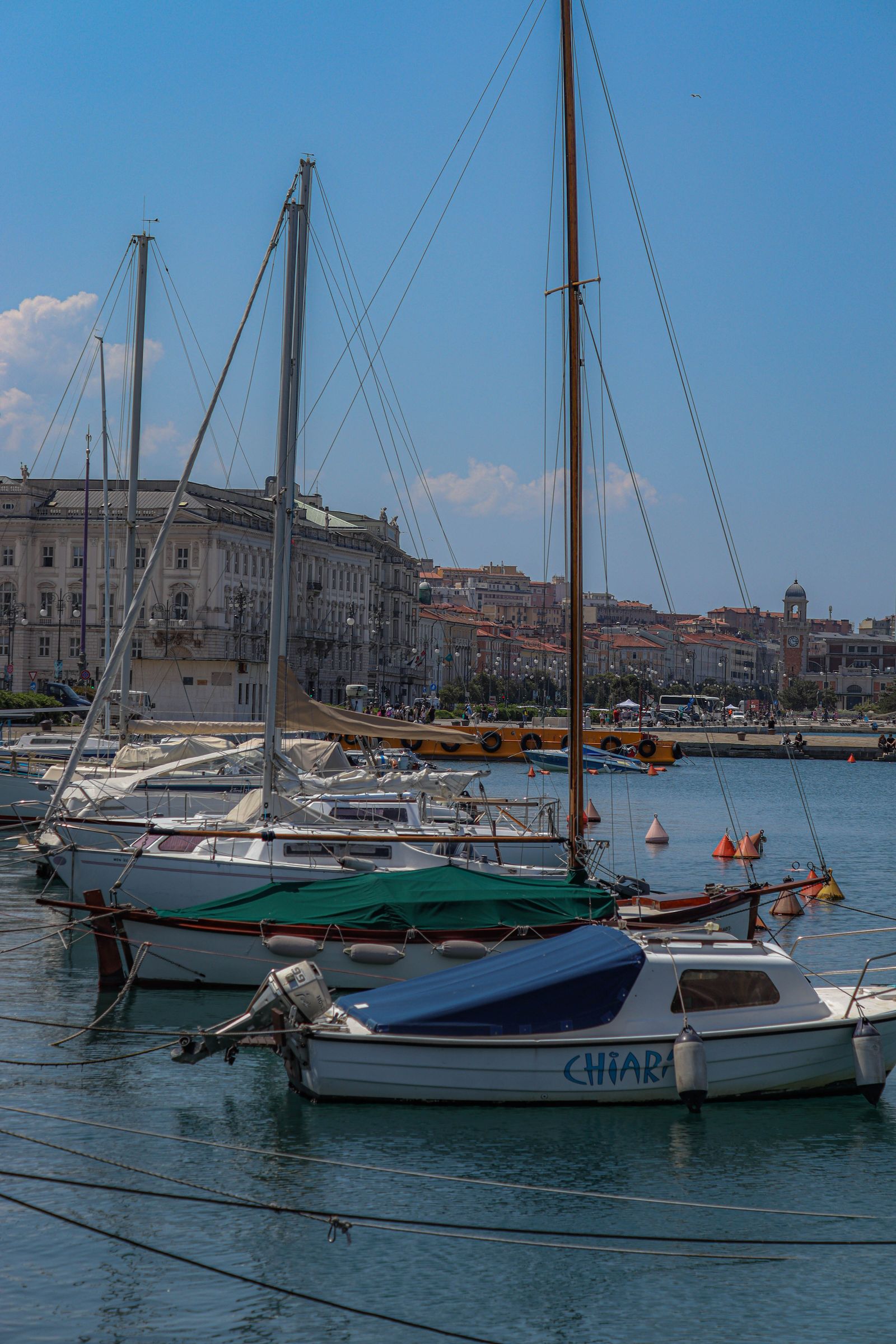 Sailboats in Trieste harbor on a clear day