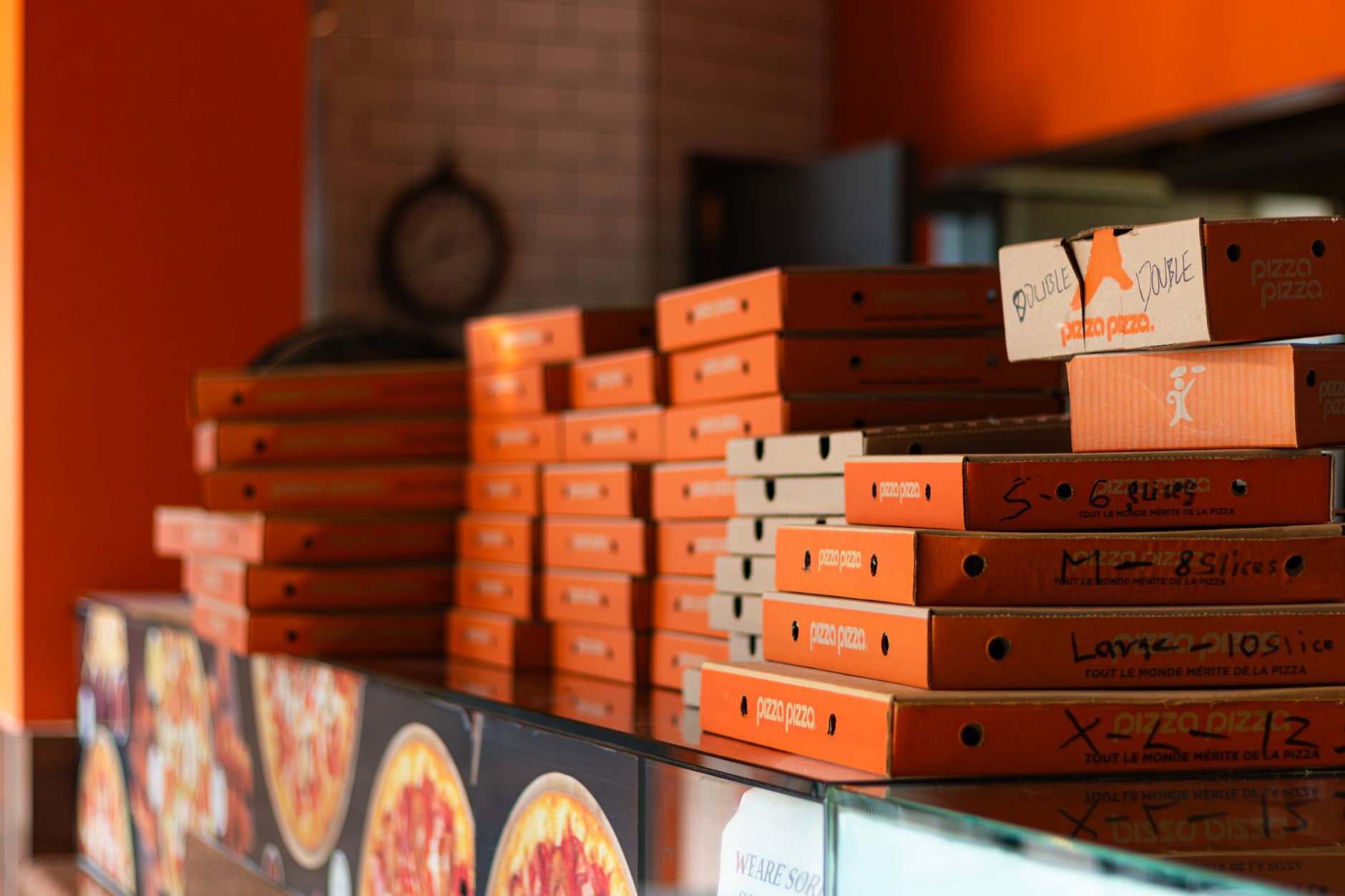 Slices of pizza with locally inspired toppings served in an international chain restaurant