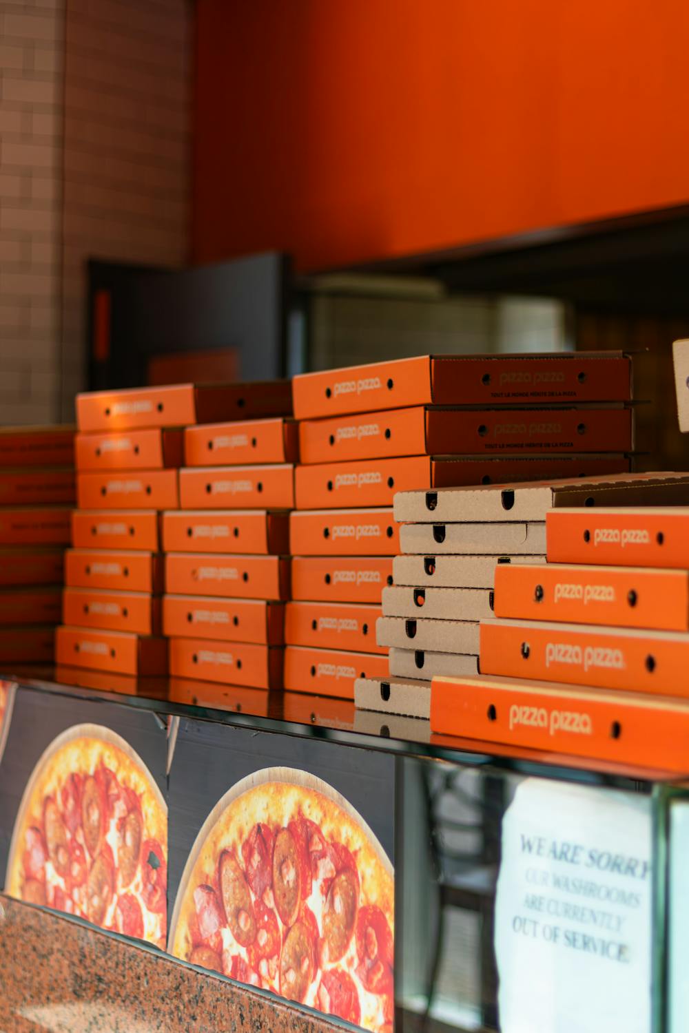 Stacked Pizza Boxes in Toronto Pizzeria · Free Stock Photo
