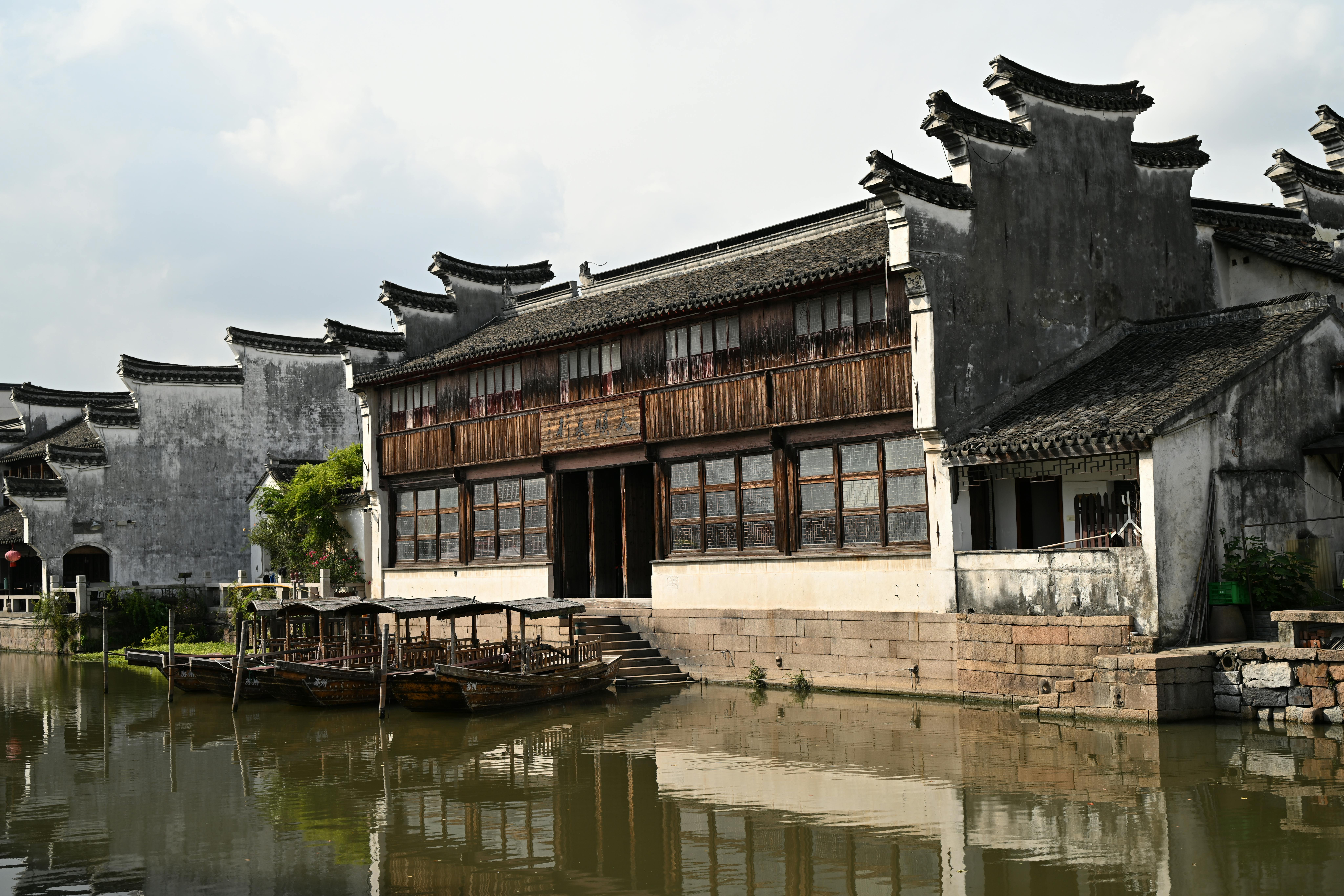 Explore the beauty of Chinese architecture alongside a peaceful canal scene in this traditional water town.