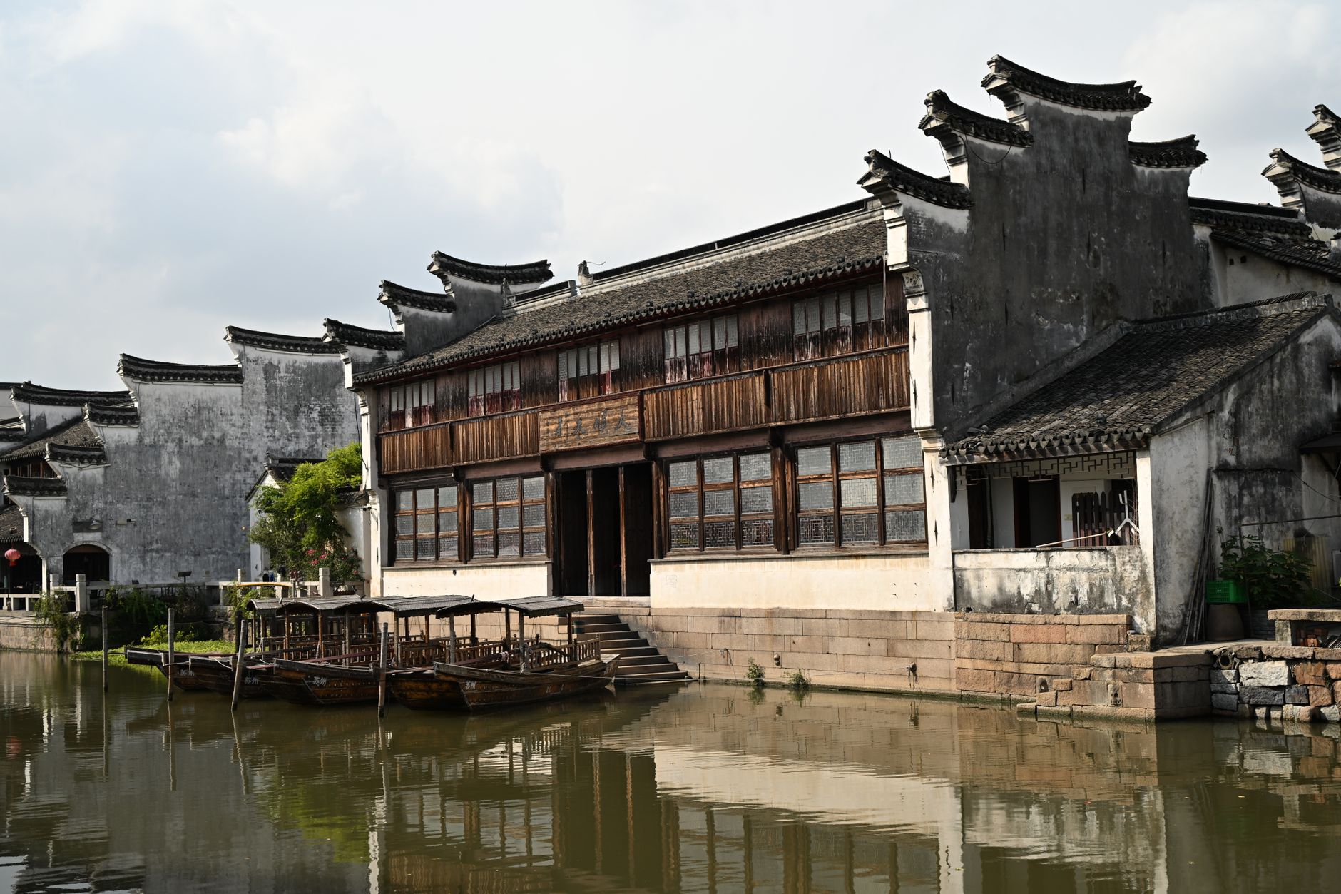 Explore the beauty of Chinese architecture alongside a peaceful canal scene in this traditional water town.