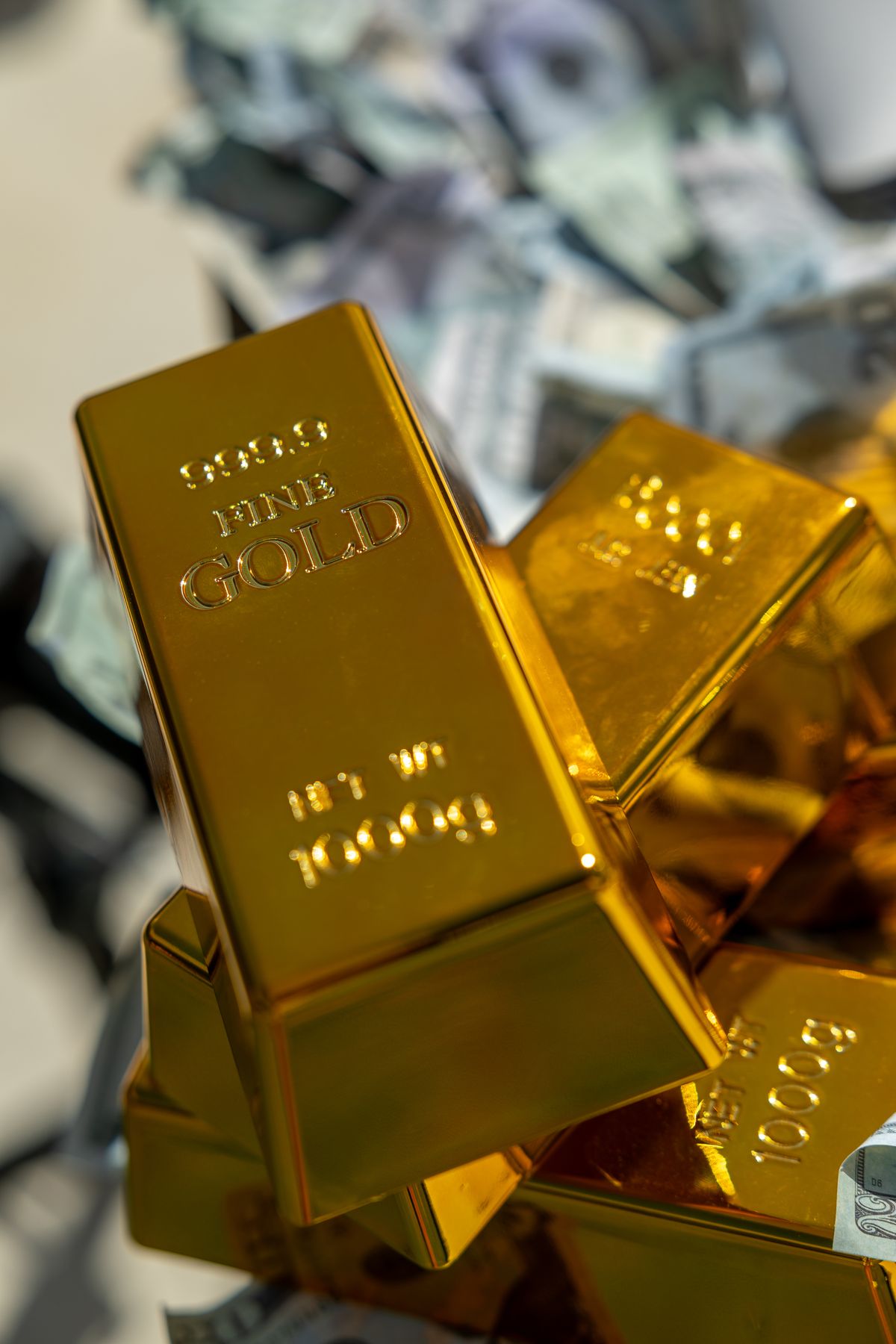 Gold bars with money