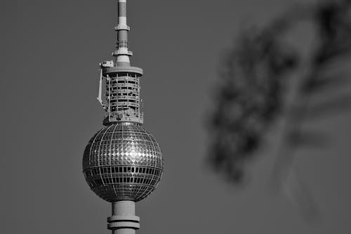 Free Monochrome close-up of the iconic Berlin TV Tower in daylight, capturing its detailed architecture. Stock Photo
