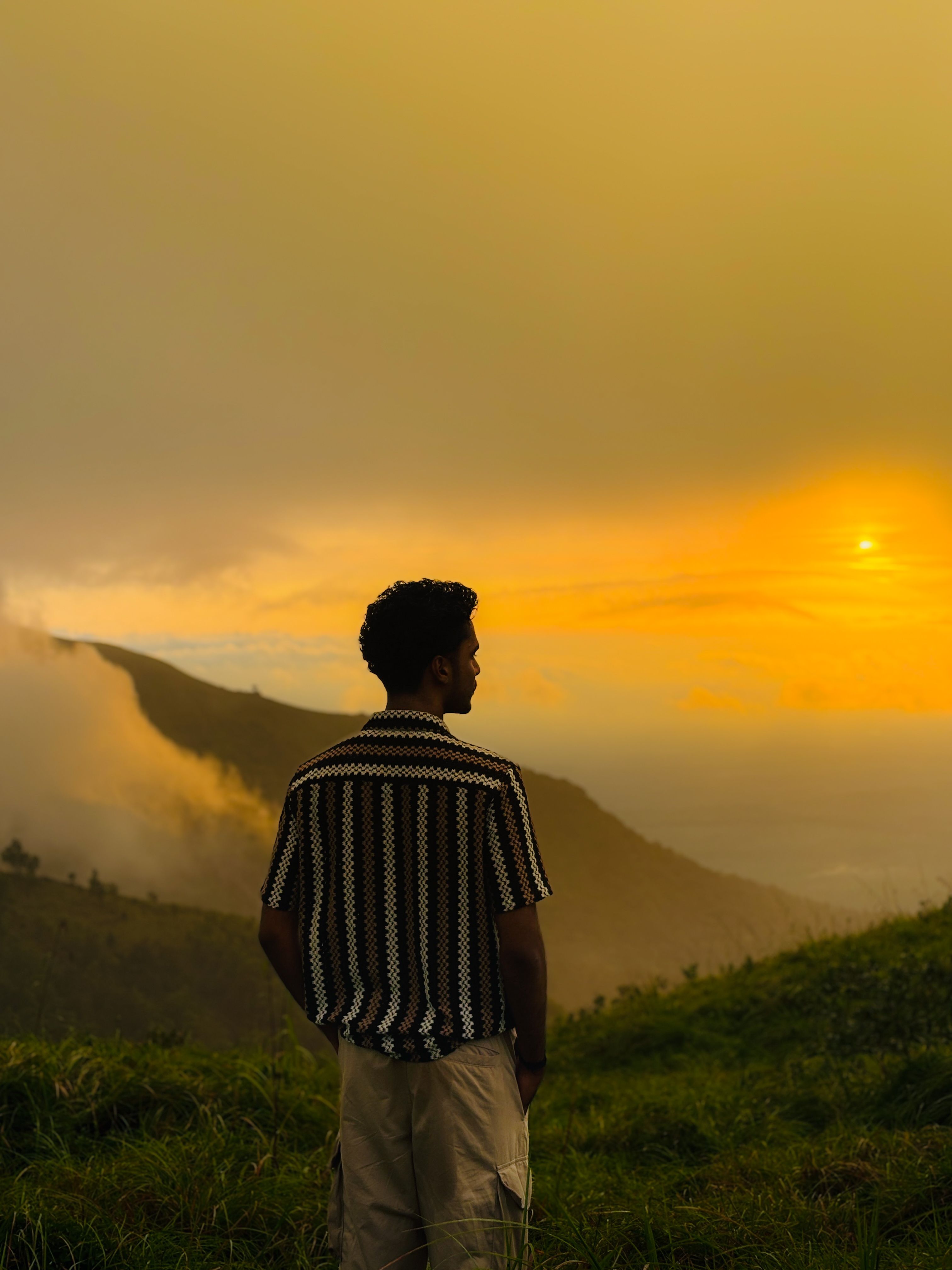 Contemplative Man Admiring a Golden Sunset · Free Stock Photo