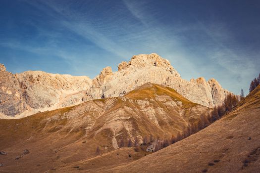 Breathtaking view of rocky mountain peaks under a clear blue sky showcasing natural beauty.
