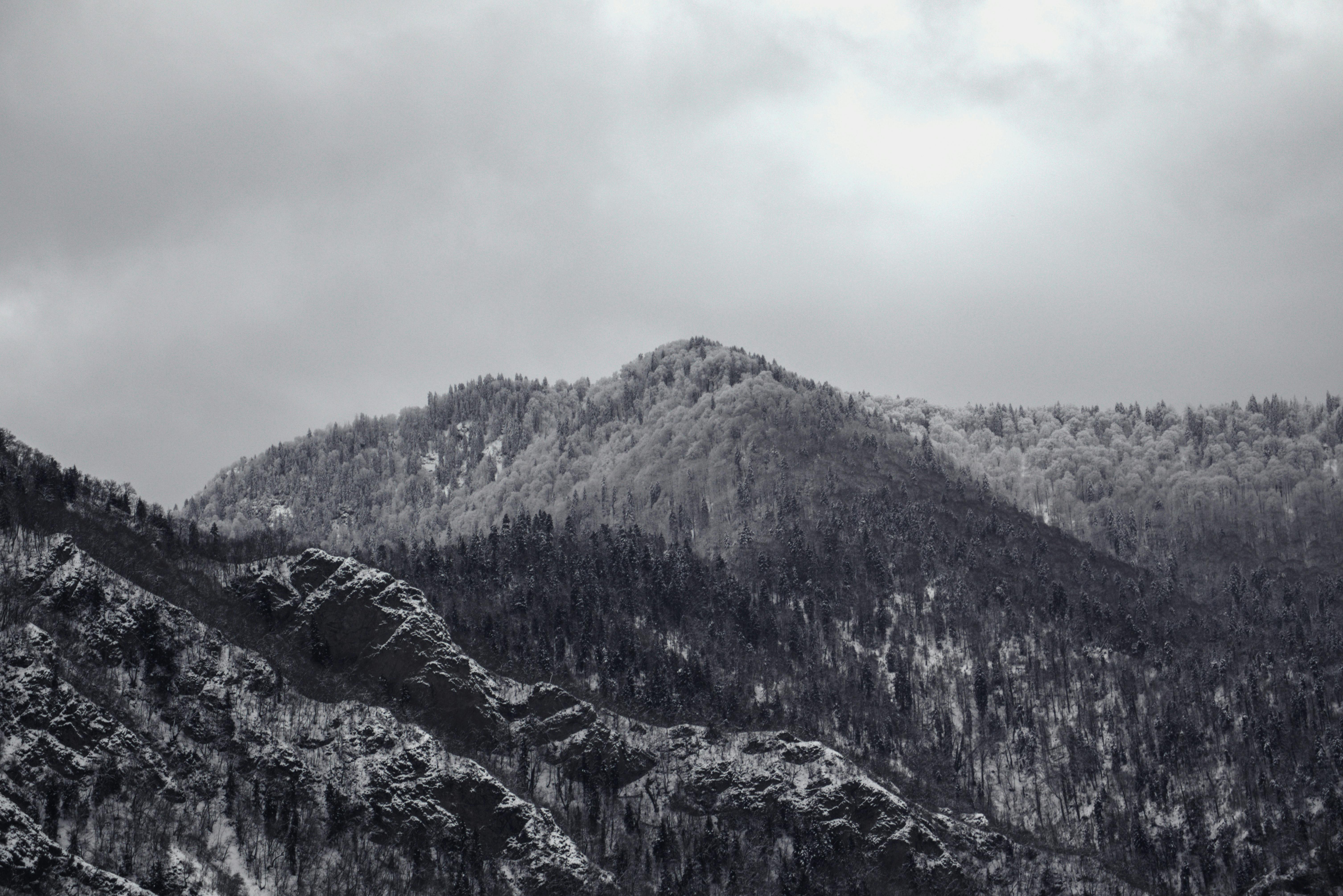 Prescription Goggle Inserts - Majestic winter landscape of snow-covered mountains in Georgia, under cloudy skies.