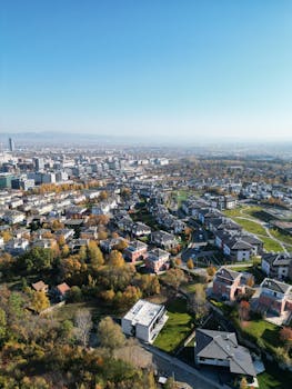 Drone capture of Sofia, Bulgaria showcasing cityscape and autumn colors.