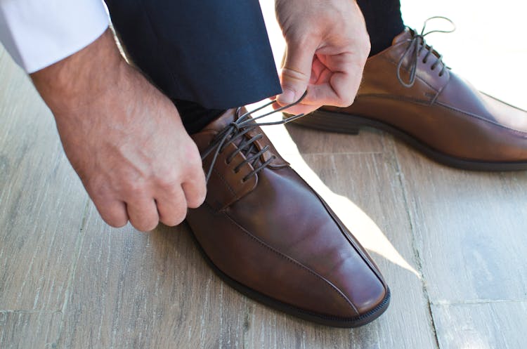 Close-up Of Man Wearing Shoes