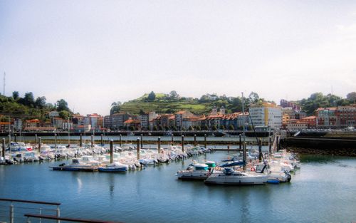 Free Vibrant marina in Asturias, Spain with boats and charming coastal architecture. Stock Photo