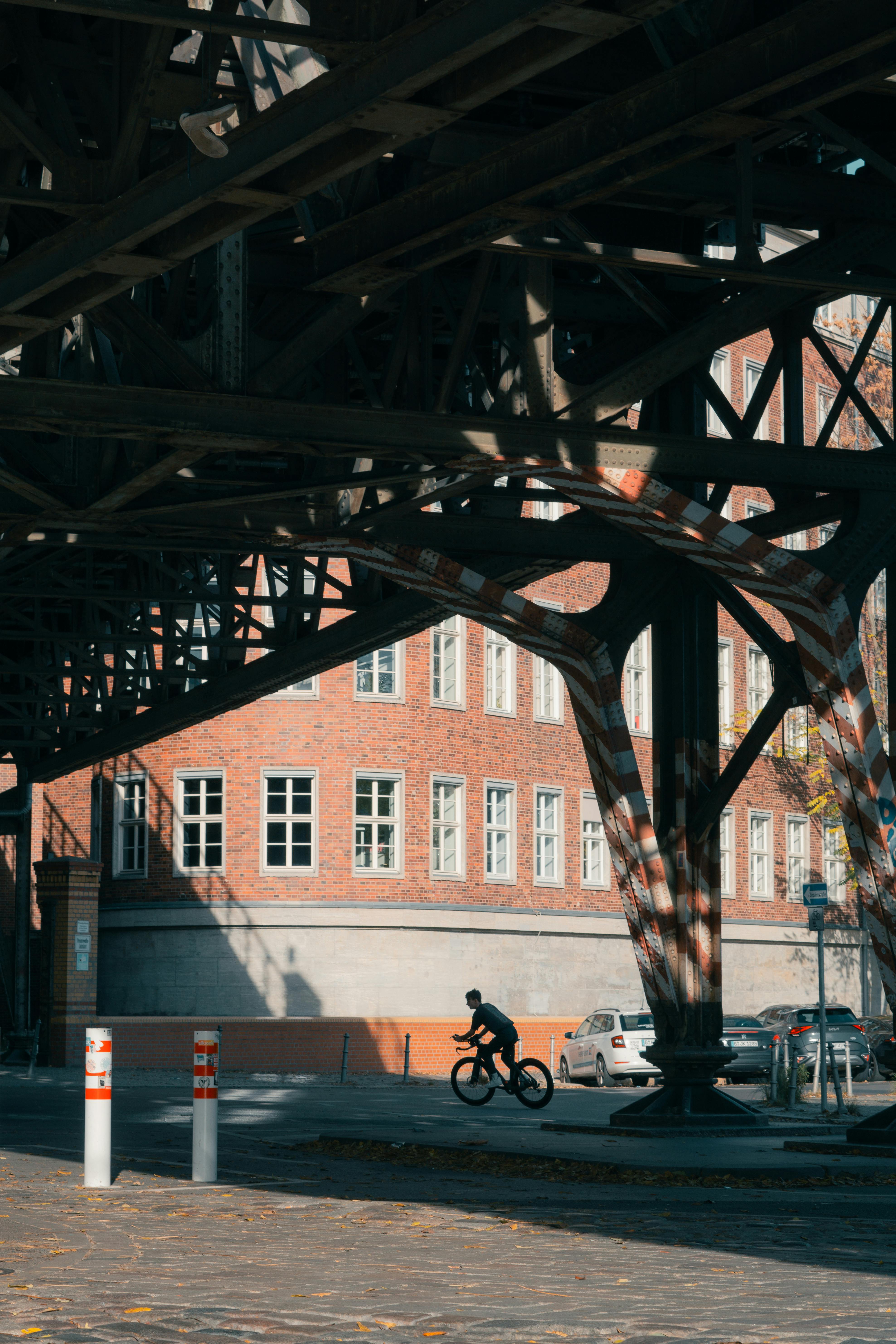 urban cyclist under berlin bridge