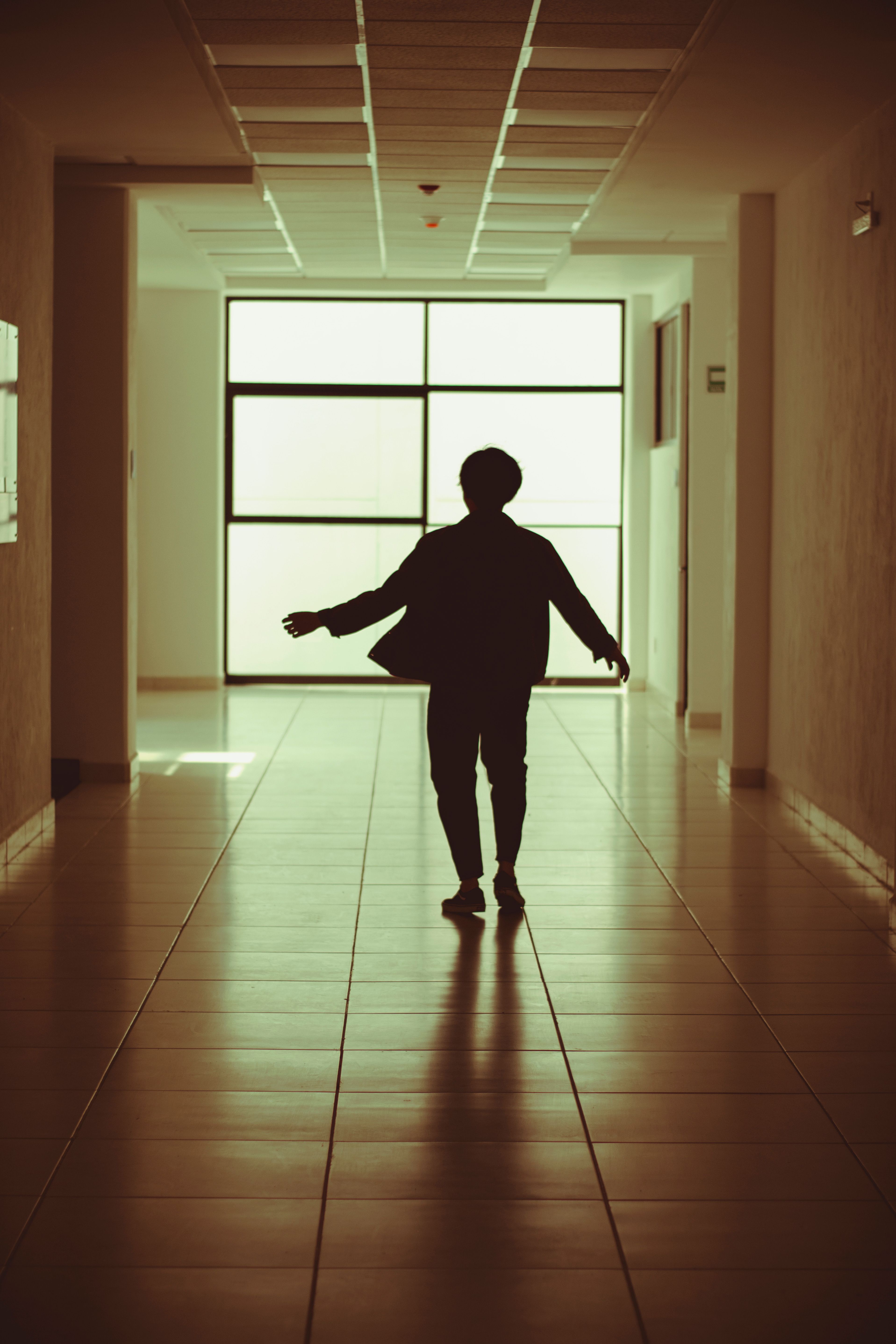 Silhouette of a Person in a Hallway · Free Stock Photo